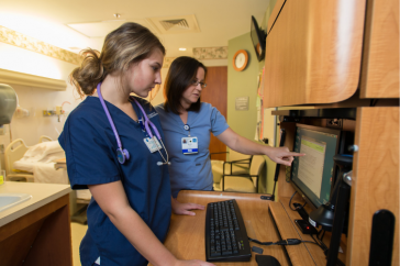 Nurse and nursing student at Portsmouth Regional Hospital