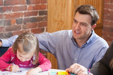 Psychology professor Nicholas Mian working with a child in the child psychology lab at UNH Manchester