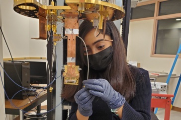 Adrika Dasgupta works on space detectors in a lab. 