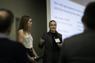 Students presenting on stage