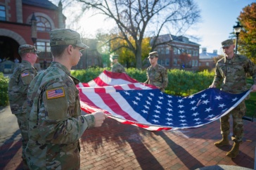 UNH ROTC students holding American flag