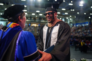 Student accepting diploma