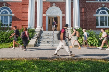 Time lapse shot of students walking in front of academic building