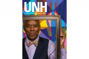 UNH Magazine Winter 2019 Cover - Richard Haynes holding a picture frame 
