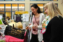 Sydney Howard '17 and Sierra Eugley '15 at a farmers market