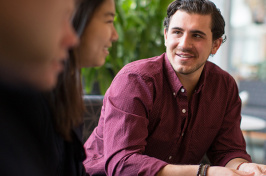 Eric Skyta '15 in the Great Hall at the UNH Peter T. Paul College of Business and Economics 