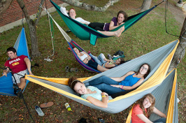 students relaxing in hammocks