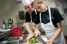 UNH students cooking Chinese food in the kitchen