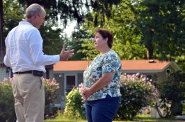 Paul Bradley talks with Bonnie Rose at Powder House Cooperative in Exeter.