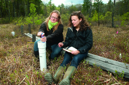 Ruth Varner and student working in the field