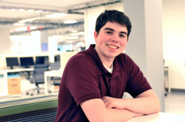 Griffin LeClerc sits at a table inside the IOL.
