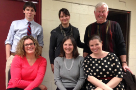 Donors and students involved with the arts program pose for a portrait together.