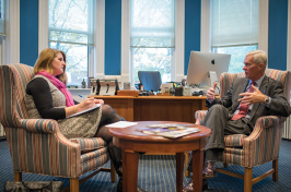 UNH Magazine Editor-in-chief Kristin Waterfield Duisberg talking with President Mark Huddleston