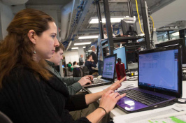 A student working on a computer at UNH's IOL