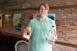 UNH graduate Connor Roelke in his nitro cold brew coffee shop