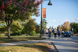 Students at a busy intersection on UNH campus