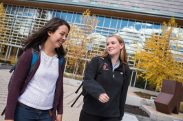 Julianne Calef '17 walking with another UNH student
