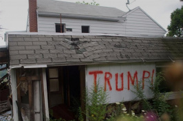 abandoned home with TRUMP spray painted on the side