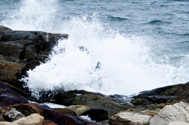 waves crash on rocks