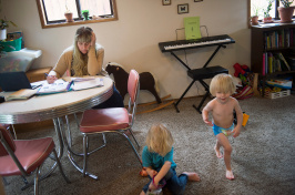 Jasmin Cross trying to study while her sons, Sebastian and Vyvyan, played in their home in Portland, Ore. (Credit Amanda Lucier for The New York Times)