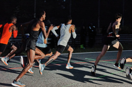 Seconds into the sub-two marathon attempt in Italy, Eliud Kipchoge (in orange) trails Zersenay Tadese (in light blue) and Lelisa Desisa (in white). Photo: CAIT OPPERMANN