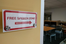 "Free Speech Zone" sign next to a doorway