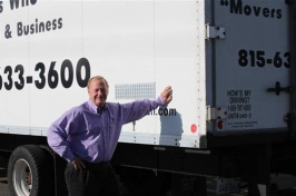 Mover Bob Christensen of Loves Park, Illinois, beside one of his trucks. 