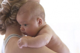 a woman holding a baby