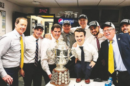 Manchester native Mat Myers, to the right of the Campbell Trophy, poses with Nashville Predators staff and coaches including head coach Peter Laviolette, to the left of the trophy. (COURTESY)