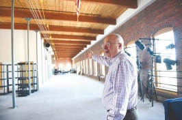 Mike Decelle, dean of the University of New Hampshire-Manchester, gives a tour of the top floor of the old Pandora building in Manchester (DAVID LANE/UNION LEADER)