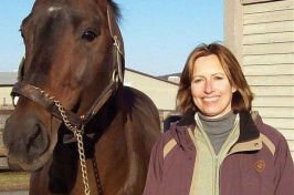 UNH alumna Susan J. Bruns ’78 ’95G with a horse