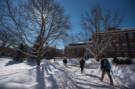 UNH students walking through a snowy campus