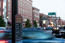 sign and busy street in downtown Concord, NH