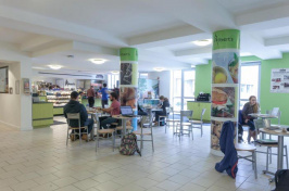 students sitting in Albert's Cafe at UNH