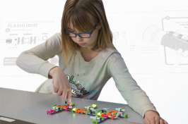 a young girl playing with LittleBits at East Rochester School