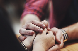 two people holding hands - Getty Images