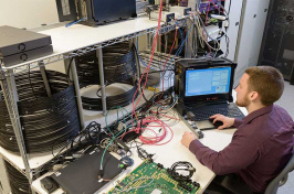 a student working at a computer in the UNH Interoperability Laboratory or IOL