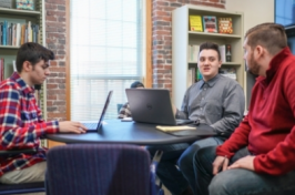 UNH Manchester students collaborating on campus newspaper