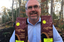 UNH organic chemist Glen Miller with CoffVee Heart Healthy Coffee bags