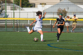 UNH women's soccer player Brooke Murphy about to kick the ball