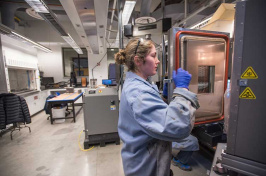 UNH student Kate Haslett '18 stress testing asphalt in a Kingsbury lab