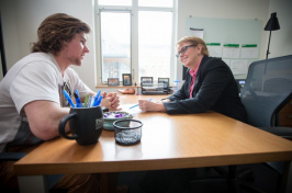 a UNH student and professor talking