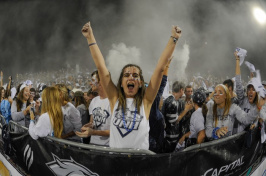 Hailey Simpson ’18 cheering in the student section at a UNH football game