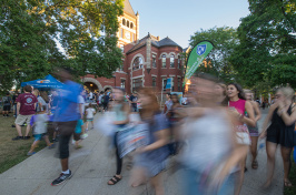 UNH students walking in front of Thompson Hall on University Day