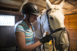 a student and a horse at the University of New Hampshire