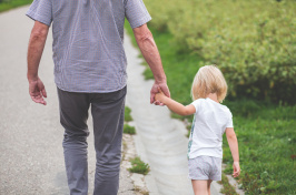 Image of child holding someone's hand