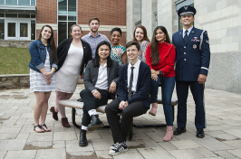 group photo of nine student ambassadors outside academic building