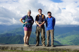 Students in Nepal with mountains in the background.