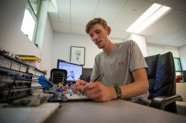 Matt Griswold '18 works at the Makerspace in the UNH ECenter