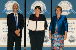 UNH Alumna receiving an award